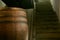 Wooden barrel on a dark background, in a workshop, in an old room. production of barrels for cognac and wine, in a low