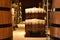 Wooden barrels stored in a modern cellar, beautiful place for an exceptional final product.