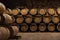 Wooden barrels for wine aging in the cellar..Italian wine