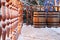 Wooden barrels and wood railing in snow