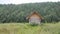 Wooden bathhouse in the beautiful Russian nature by the river.