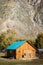 Wooden bathhouse on a tourist parking in a mountain valley