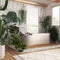 Wooden bathroom in white and beige tones with freestanding bathtub. Windows with venetian blinds. Biophilic concept, many