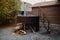 Wooden bathtub with stove on outside terrace