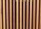 Wooden battens vertical texture, brown color.