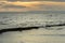 Wooden beach groin semi submerged by tide at sunset. British Col