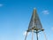 Wooden beacon called Baken or Kaap against blue sky on island Schiermonnikoog, Netherlands