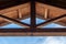 Wooden beam ceiling with symmetrical design