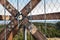 Wooden beams with screws in the structure. Assembling and connecting wooden beams. Detail of building connections. The constructio