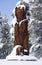 Wooden bear in snow