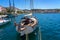 Wooden beautiful sailer boat in mali losinj island port croatia with colorful buildings and blue sea