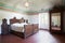 Wooden bedroom in ancient interior with fresco