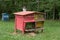 Wooden beehive with bees in a honey farm