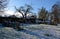 wooden beehives in a snow shower. Snow falls on homemade wooden