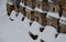 Wooden beehives in a snow shower. Snow falls on wooden beehives of domestic production. hidden bees, however, know nothing. Autumn