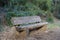 Wooden bench close up in the park in the south of France.