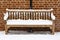 Wooden bench covered in snow