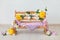 A wooden bench decorated with yellow and white chrysanthemums flowers