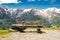 Wooden Bench with Dramatic Alpine Mountain Vista