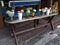 Wooden bench with drinks on playa tortugas at Caribbean Sea in Cancun city at Quintana Roo in Mexico