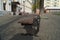 Wooden bench with feet of black swans