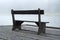 Wooden bench in the fog near the lake. Empty bench near lake. Bench near misty lake. Lonely or relax background concept