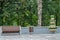 Wooden bench, garbage bin and basket of flowers