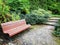 Wooden bench in a garden in early autumn