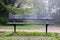 Wooden bench at hiking trail for rest and taking break