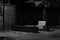 Wooden bench, illuminated by a lamppost