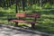 Wooden bench illuminated by the sun in the park