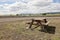 A wooden bench in a landscape on a desert Iceland for relaxing tourists