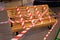 Wooden bench in the mall is surrounded by prohibition ribbons