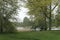 Wooden bench overlooking a tranquil spring lake