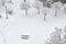 Wooden bench picnic table in a park at winter