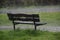 Wooden bench in the rain