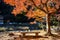 A wooden bench under the maple tree by the stream in autumn at Korankei valley