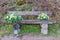 Wooden bench of a viewpoint with two bouquets, with the inscription: you are in the right place with the Limburg landscape