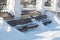 Wooden bench in winter snowdrifts