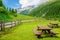 Wooden benches to picnic in Alpine valley, Austria