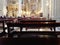 Wooden benches to sit inside a baroque Catholic church during the liturgy.