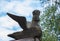 Wooden bird of happiness - carved decoration Russian ridge roof. Traditional architecture of the Russian countryside