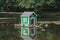 Wooden bird house at the city park pond in summer time, Zelenogradsk, Russia