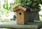 Wooden Birdhouse with Plants and Flowers