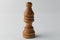 Wooden bishop chess figure on grey background