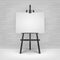 Wooden Black Easel with Mock Up Empty Blank Horizontal Canvas Standing on Floor in front of Brick Wall
