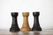 Wooden black and white rooks chess pieces