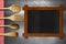 Wooden Blackboard and Kitchen Utensils