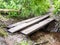 Wooden blanks three forest floor river running foot bridge