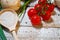 On a wooden bleached tabletop lies a set of vegetables for cooking